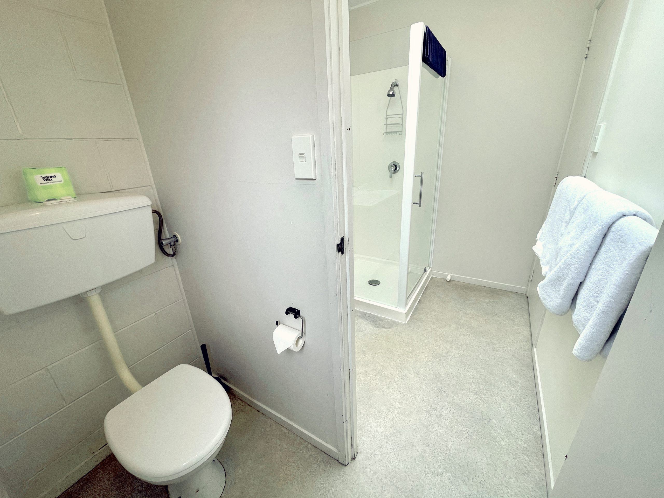 One-bedroom unit bathroom at Browns Bay Olive Tree Motel